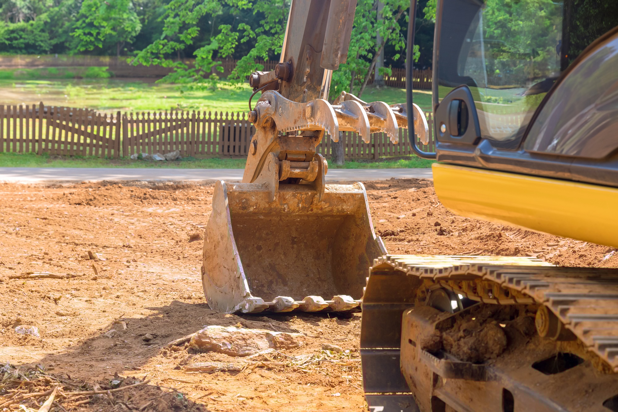At a construction site, an excavator tractor equipment is being used